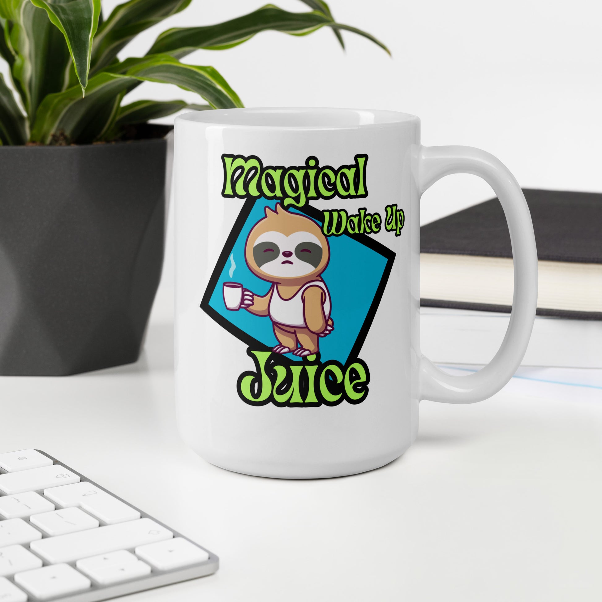 White mug with sloth design and 'Magical Wake Up Juice' text on a desk with a plant and books in the background.