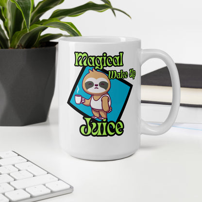 White mug with sloth design and 'Magical Wake Up Juice' text on a desk with a plant and books in the background.