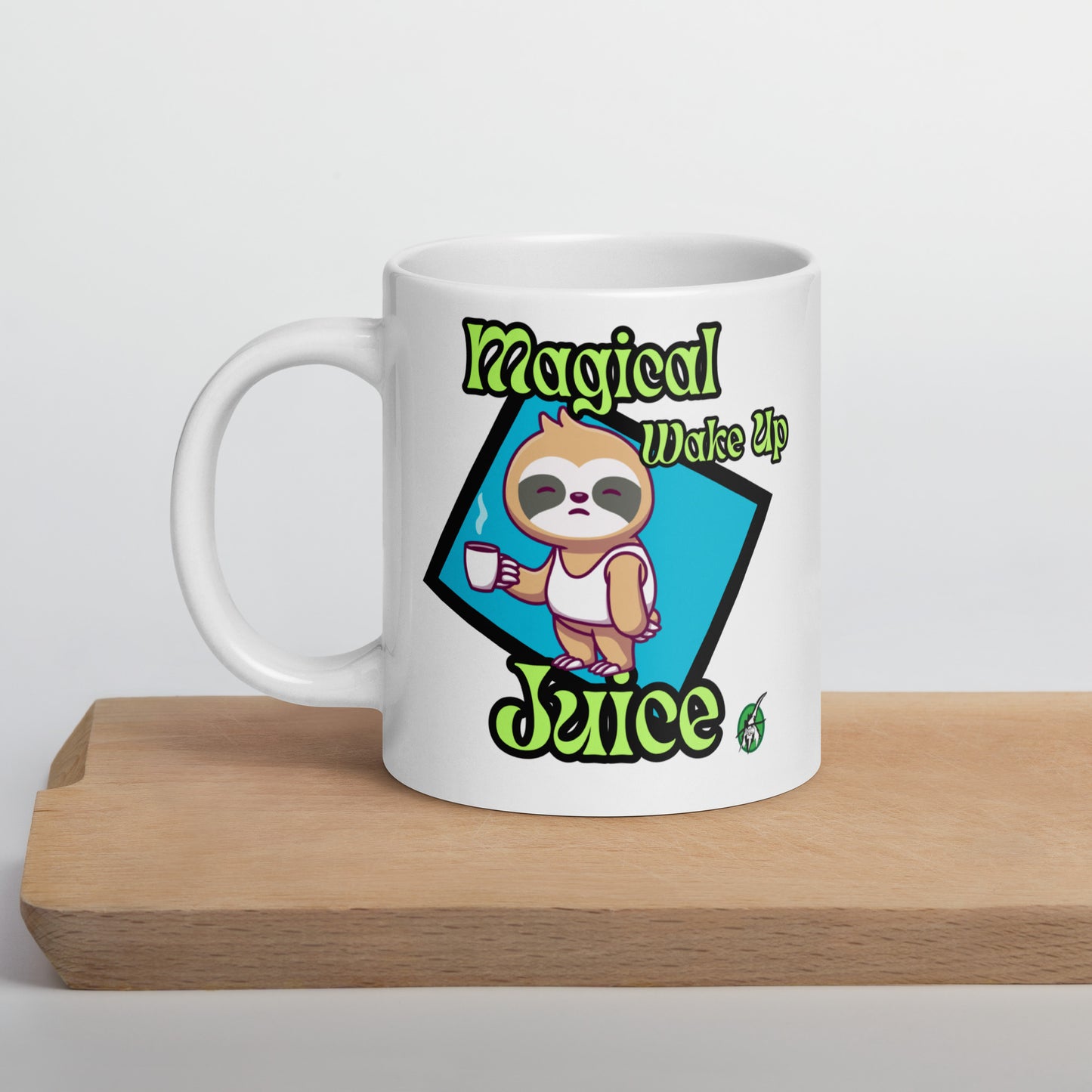 White Wizard Prints mug with a cartoon sloth design and 'Magical Wake up Juice' text on a wooden surface.