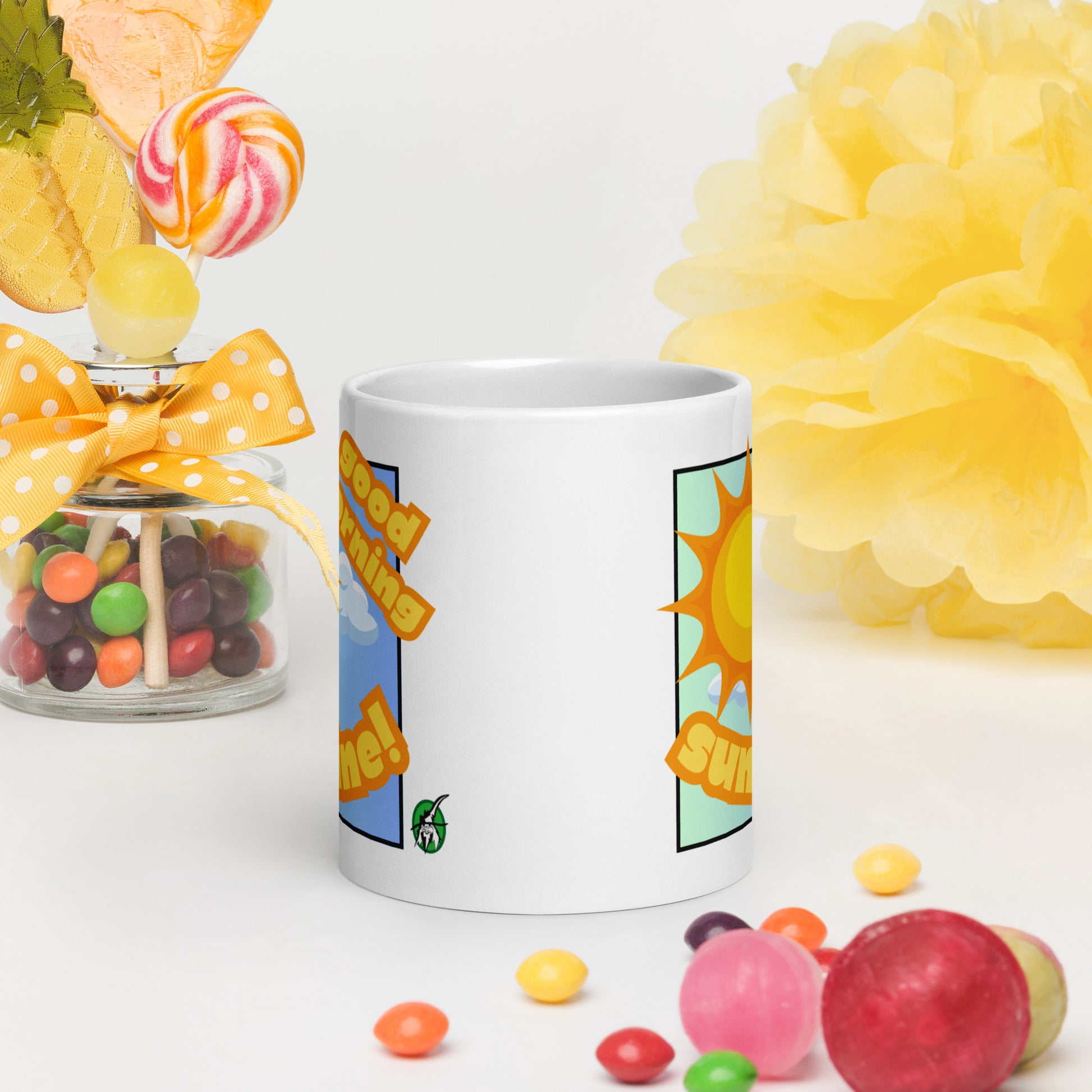White Wizard Prints mug with 'Good morning sunshine' text and sunny graphic on a white background with candies and flowers.