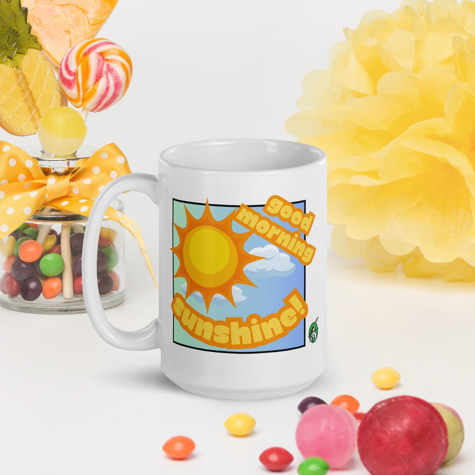 White Wizard Prints mug with 'Good morning sunshine' text and sunny graphic surrounded by candy and flowers on a white background.