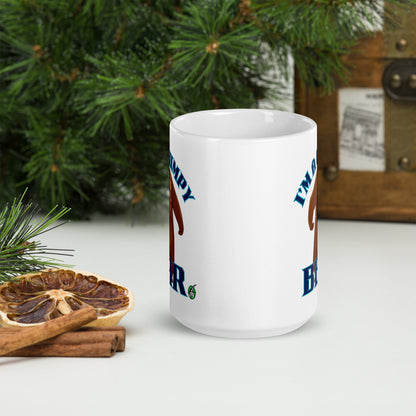 Wizard Prints white mug with grumpy bear graphic and 'I'm a grumpy bear' text on a surface with decorative nature elements.