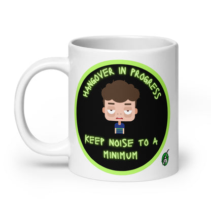 Wizard Prints white graphic mug with a sleepy cartoon character and 'Hangover in progress. Keep noise to a minimum' text on a white background.