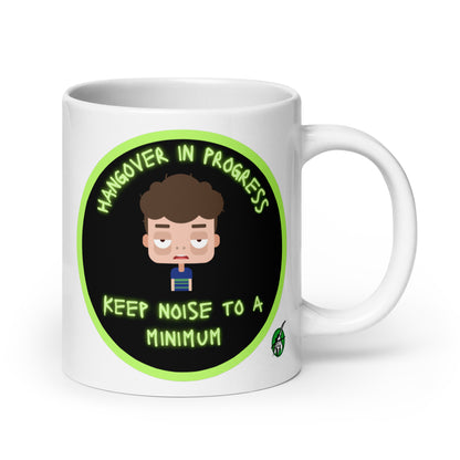 Wizard Prints white graphic mug with a sleepy cartoon character and 'Hangover in progress. Keep noise to a minimum' text on a white background.
