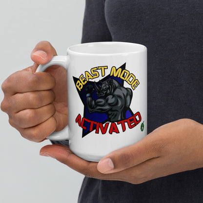 Person holding a Wizard Prints white mug with a graphic design of a rhino and  'Beast Mode Activated' text.