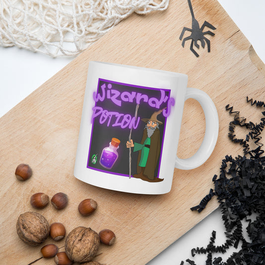 White Wizard Prints mug with cartoon wizard and 'Wizard's Potion' text on a wooden board with nuts and spider decorations.