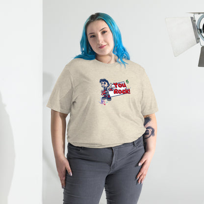A woman standing wearing a beige t-shirt by Wizard Prints featuring a printed graphic of a rock singer holding an electric guitar and the words, You Rock!