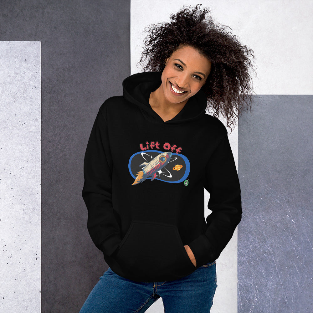 A woman standing wearing a black hoodie with a printed graphic of a rocket and the words, Lift Off. Designed by Wizard Prints.