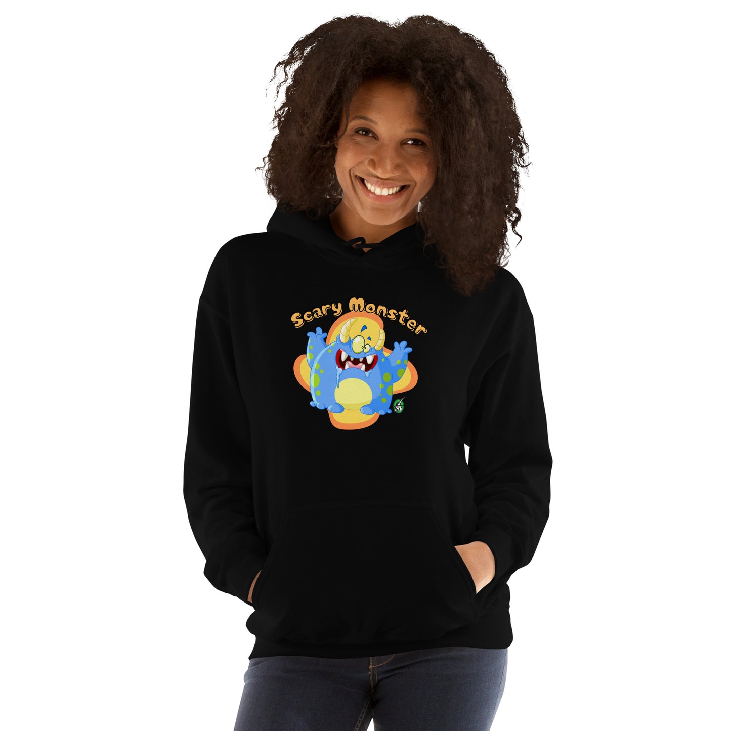 A woman standing wearing a black hoodie with a printed graphic of a cartoon monster and the words, Scary Monster. Designed by Wizard Prints.