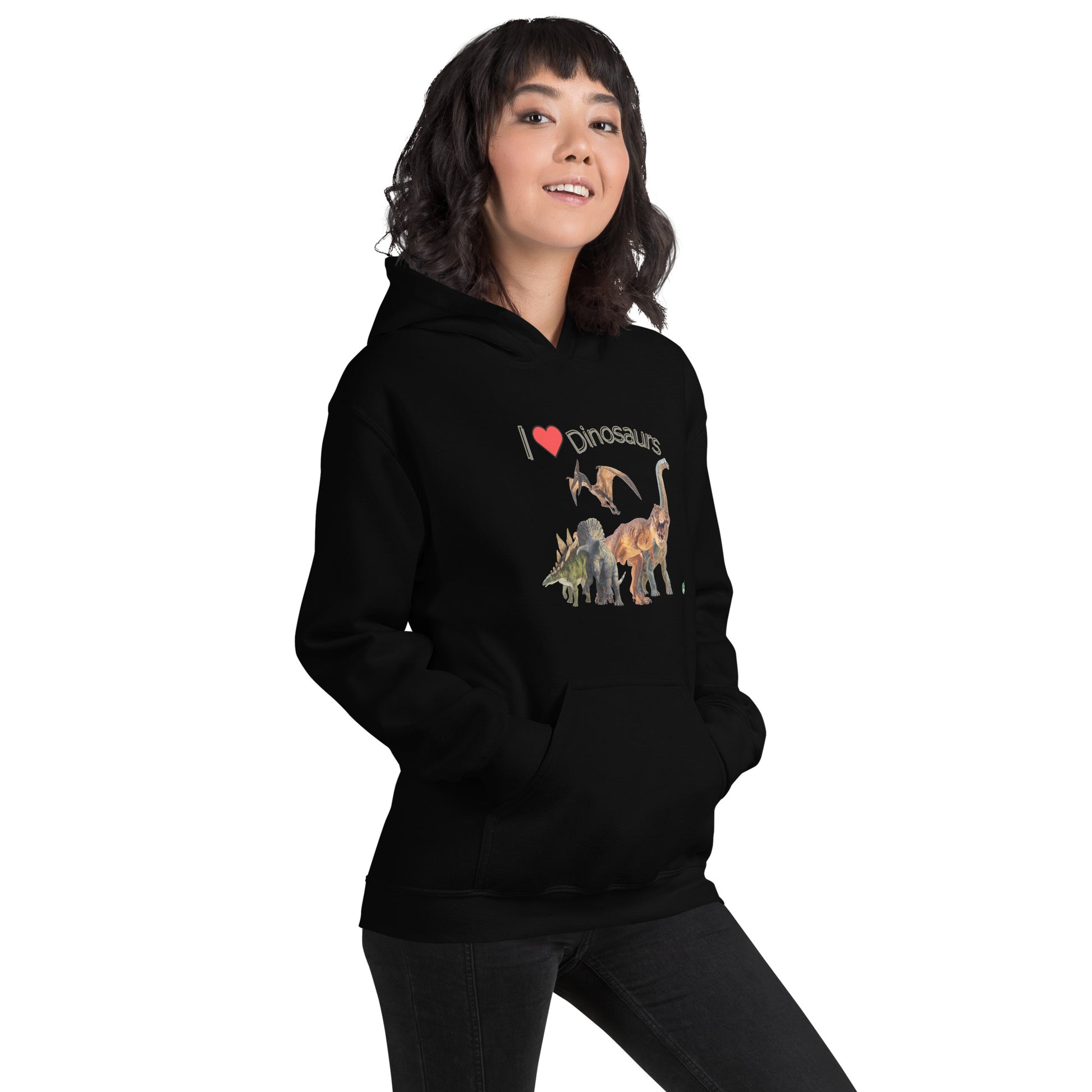 A woman standing wearing a black hoodie with the printed graphic of life like dinosaurs and the words I love Dinosaurs, by Wizard Prints.