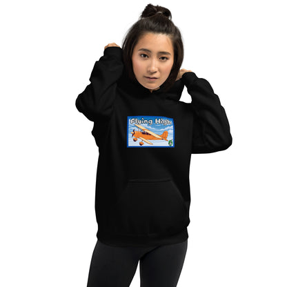 A woman standing wearing a black hoodie with the printed graphic of a vintage airplane and the words, Flying High, by Wizard Prints.