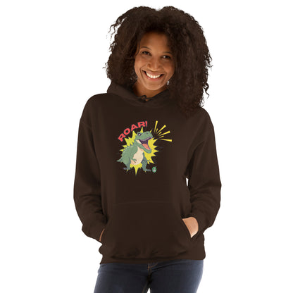 A woman standing wearing a brown hoodie with a printed graphic of a green roaring cartoon dinosaur and the word Roar! Designed by Wizard Prints