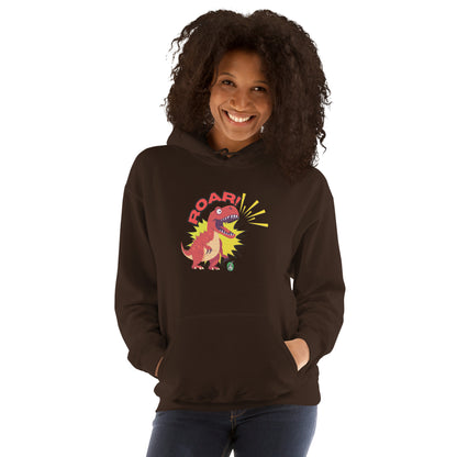 A woman standing wearing a brown hoodie with a printed graphic of a red roaring cartoon dinosaur and the word Roar! Designed by Wizard Prints