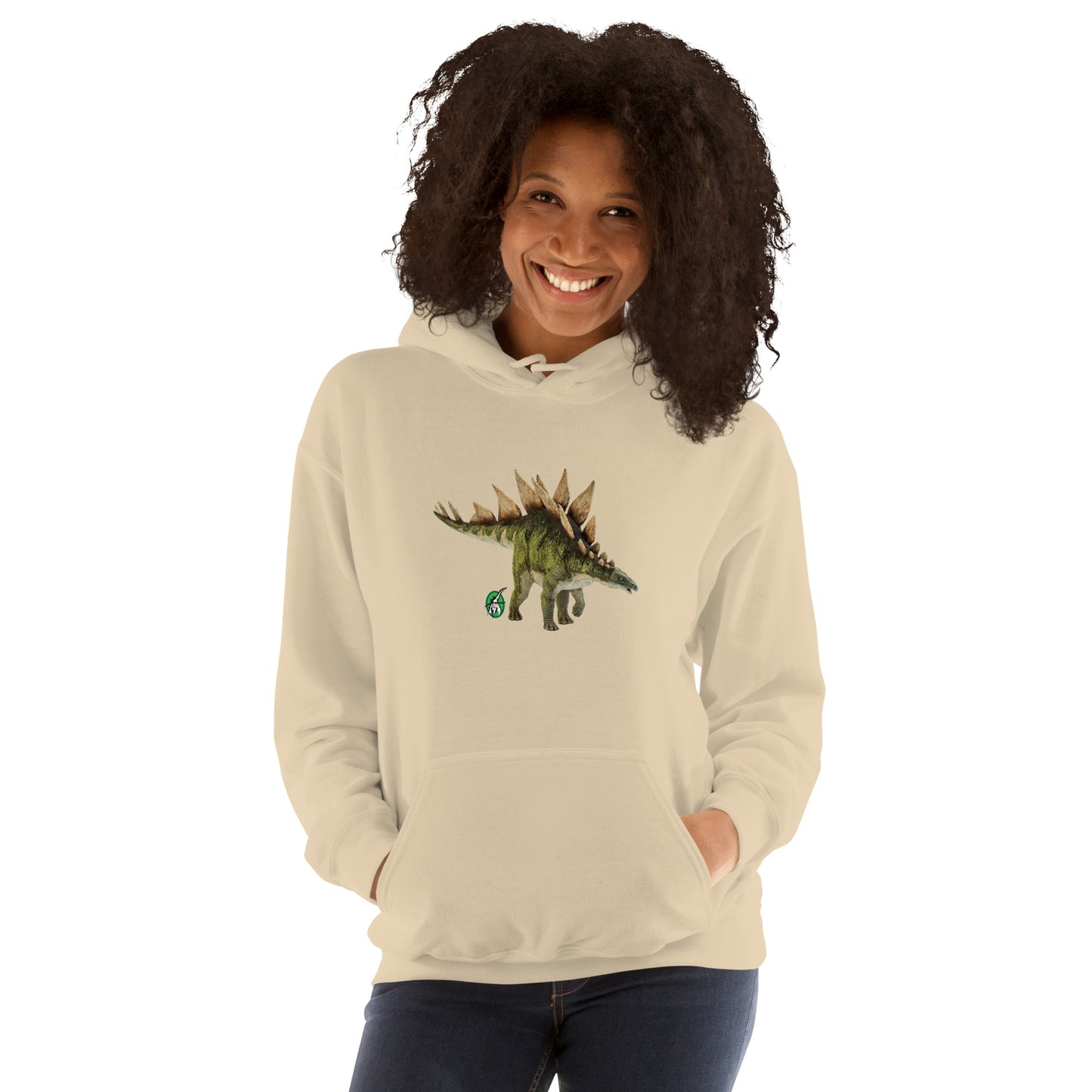 A woman standing wearing a beige hoodie with a printed graphic of a life like dinosaur, designed by Wizard Prints
