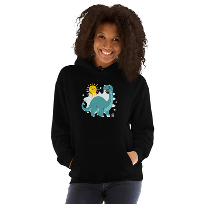 A woman standing wearing a black hoodie with a printed graphic of a smiling cartoon dinosaur and the sun. Designed by Wizard Prints.