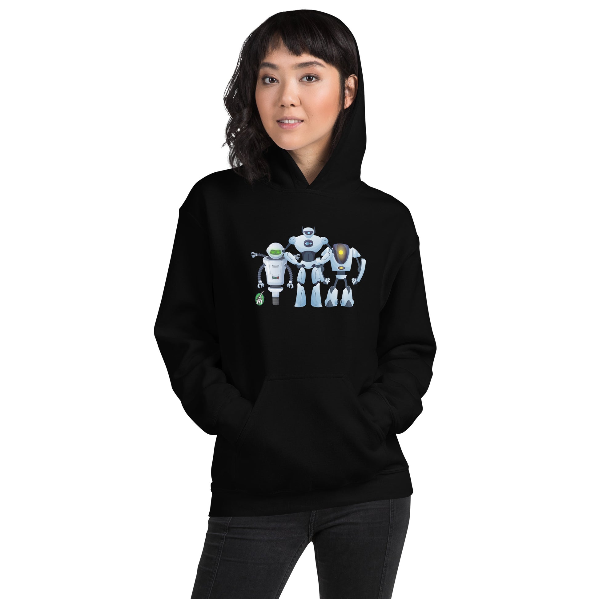 A woman standing wearing a black hoodie with a printed graphic of three cartoon robots, designed by Wizard Prints