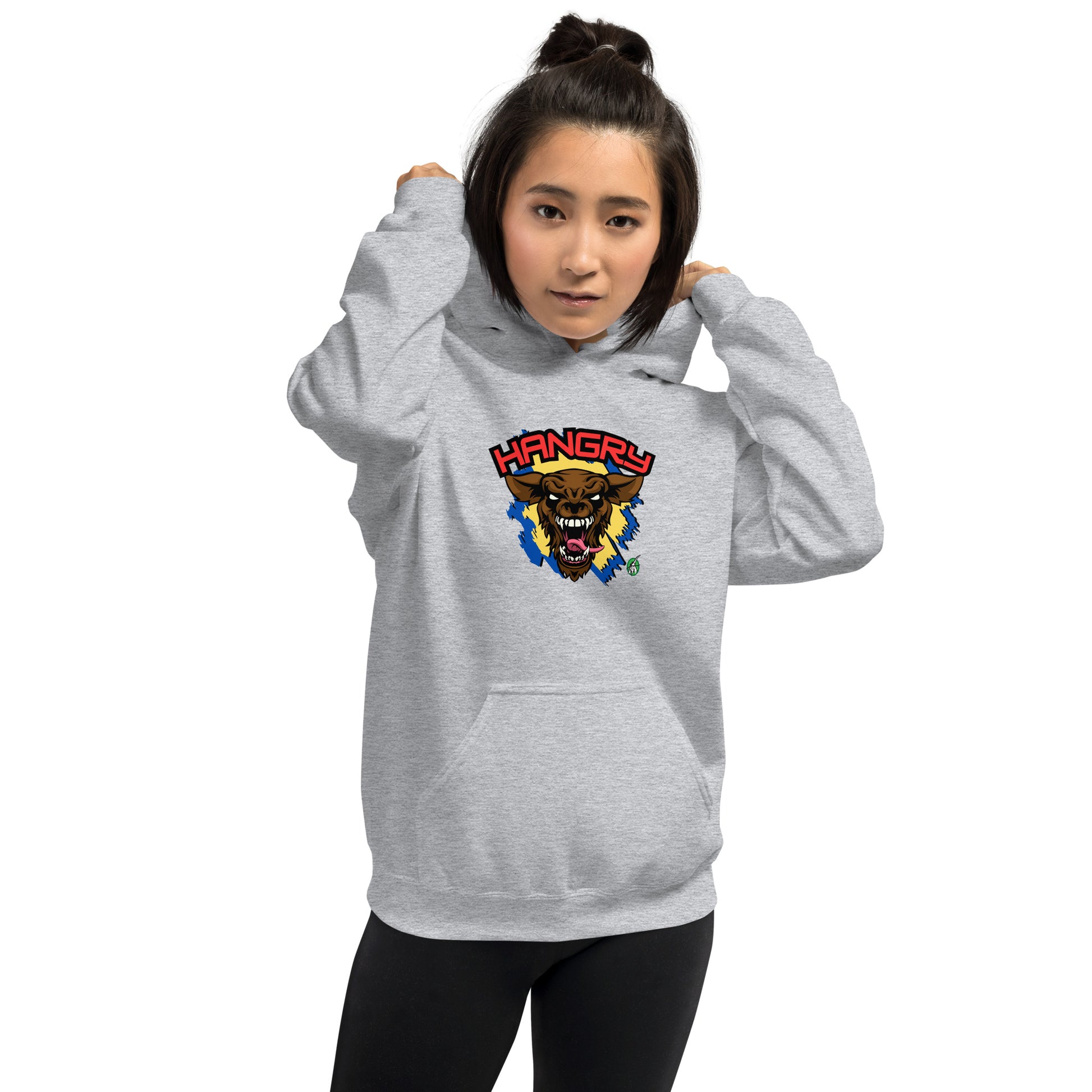 A woman standing wearing a grey hoodie by Wizard Prints featuring a printed graphic of an angry wolf and the word, Hangry.