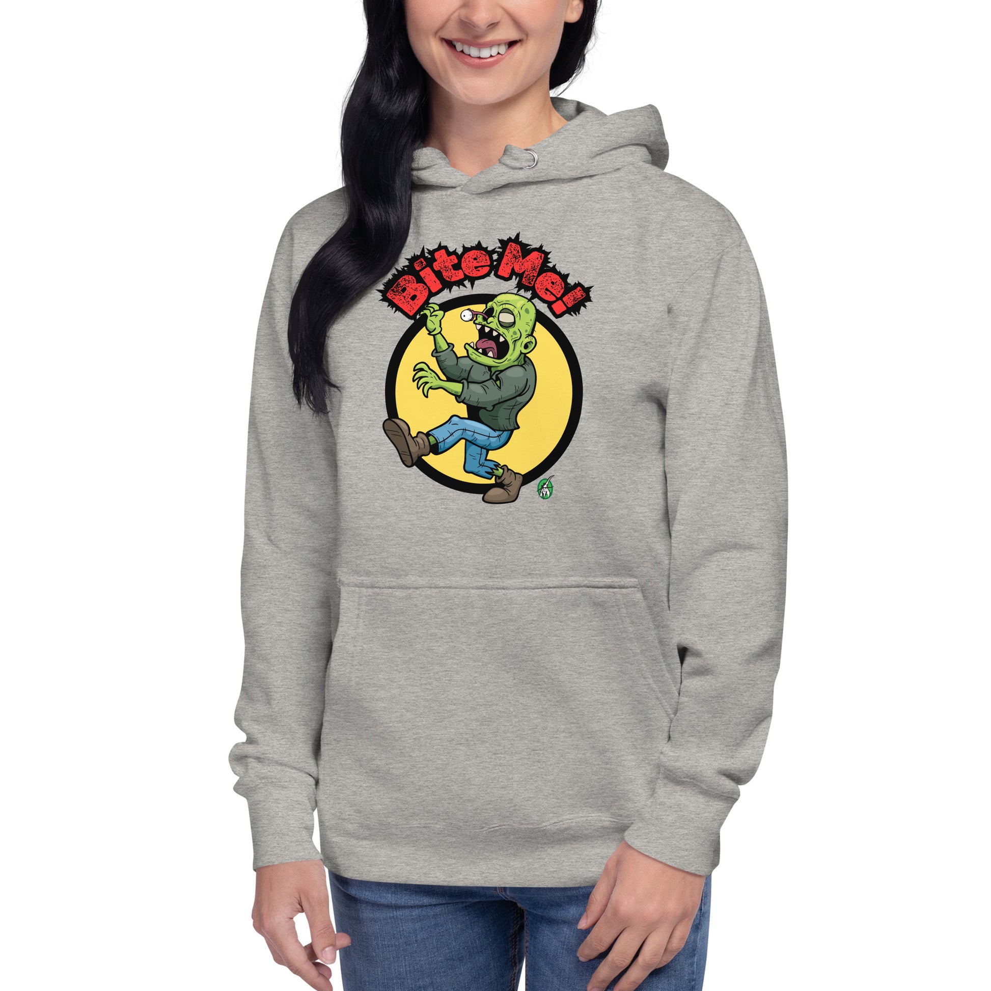 A woman standing wearing a grey hoodie with the printed graphic of a zombie with the words, Bite Me'. Designed by Wizard Prints.