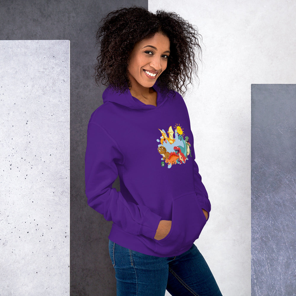 A woman standing wearing a purple hoodie with a printed graphic of different colorful dinosaur types and the sun. Designed by Wizard Prints.