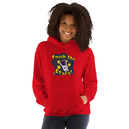 A woman standing wearing a red hoodie with a printed graphic of a cartoon astronaut and the words, Touch the Stars. Designed by Wizard Prints.