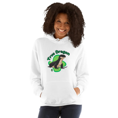 A woman standing wearing a white hoodie with a printed graphic of a komodo dragon and the words, True Dragon. Designed by Wizard Prints.