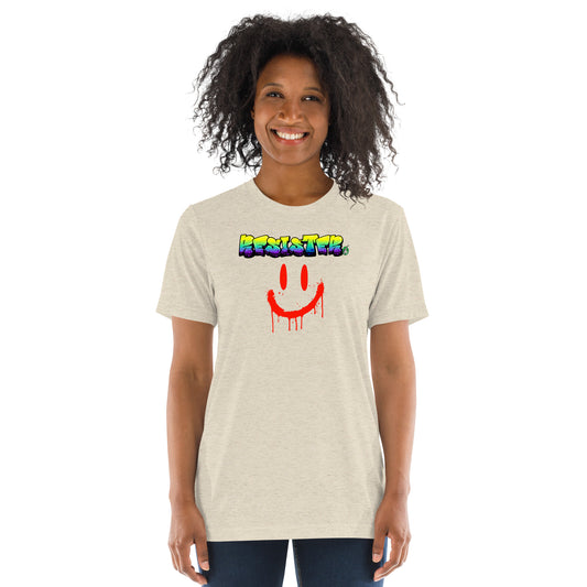 A Wizard Prints women's graphic rebel t-shirt in cream with a printed graphic on the front of Resister with weird smiley face graphitti style 