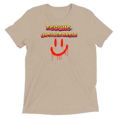 A Wizard Prints women's graphic rebel t-shirt in tan with a printed graphic on the front of Ungovernable with weird smiley face graphitti style 