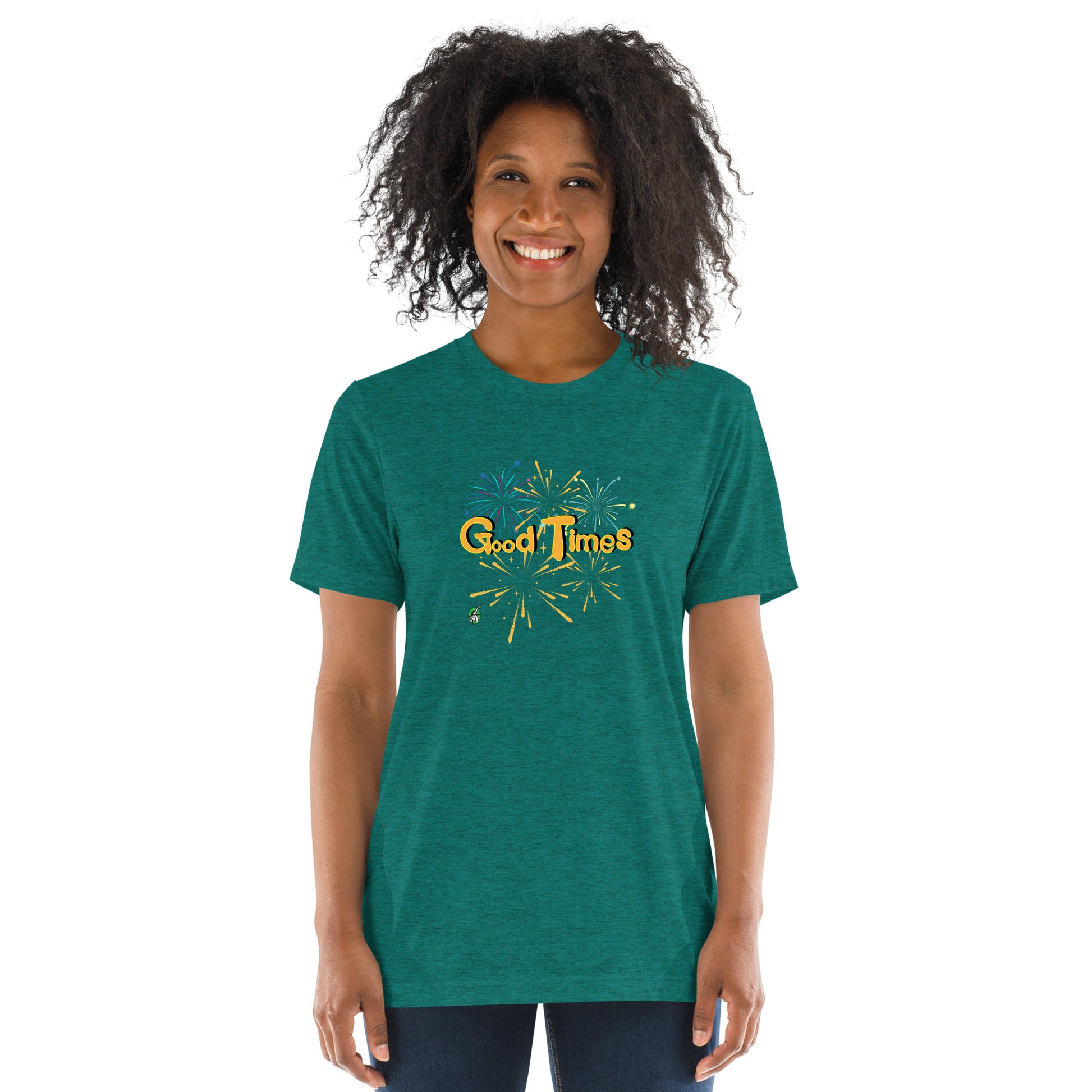 A woman standing wearing a blue green tee shirt with a printed graphic of fireworks with the words, Good Times. Designed by Wizard Prints