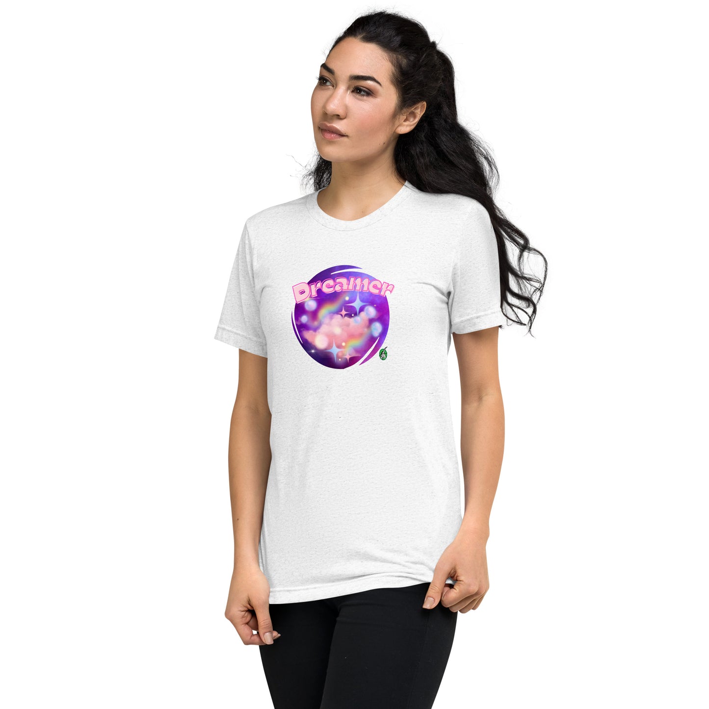 A woman standing wearing a white tee shirt with a printed graphic of a galaxy background and the word Dreamer on top. Designed by Wizard Prints