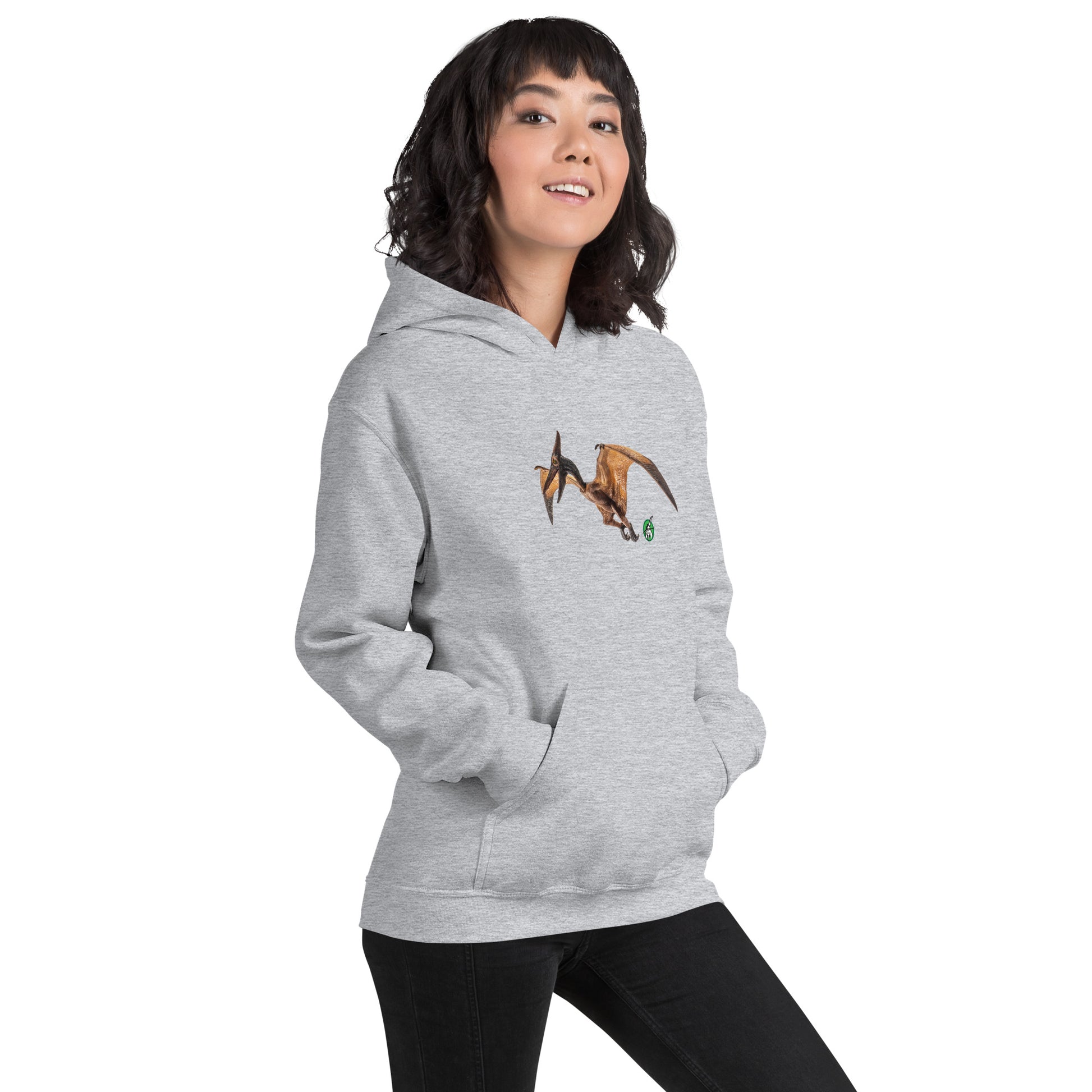 A woman standing wearing a grey hoodie with a printed graphic of a life like pterodactyl dinosaur. Designed by Wizard Prints.