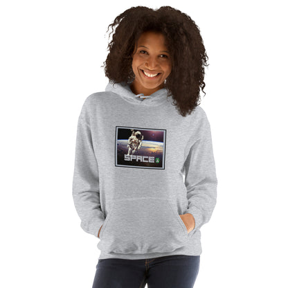 A woman standing wearing a grey hoodie with the printed graphic of a real astronaut in space and the word, Space, by Wizard Prints.