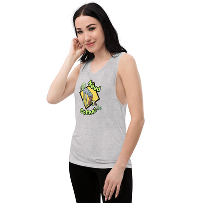 A woman standing wearing a grey tank top by Wizard Prints with a printed graphic of a zombie and the words, Need Coffee!