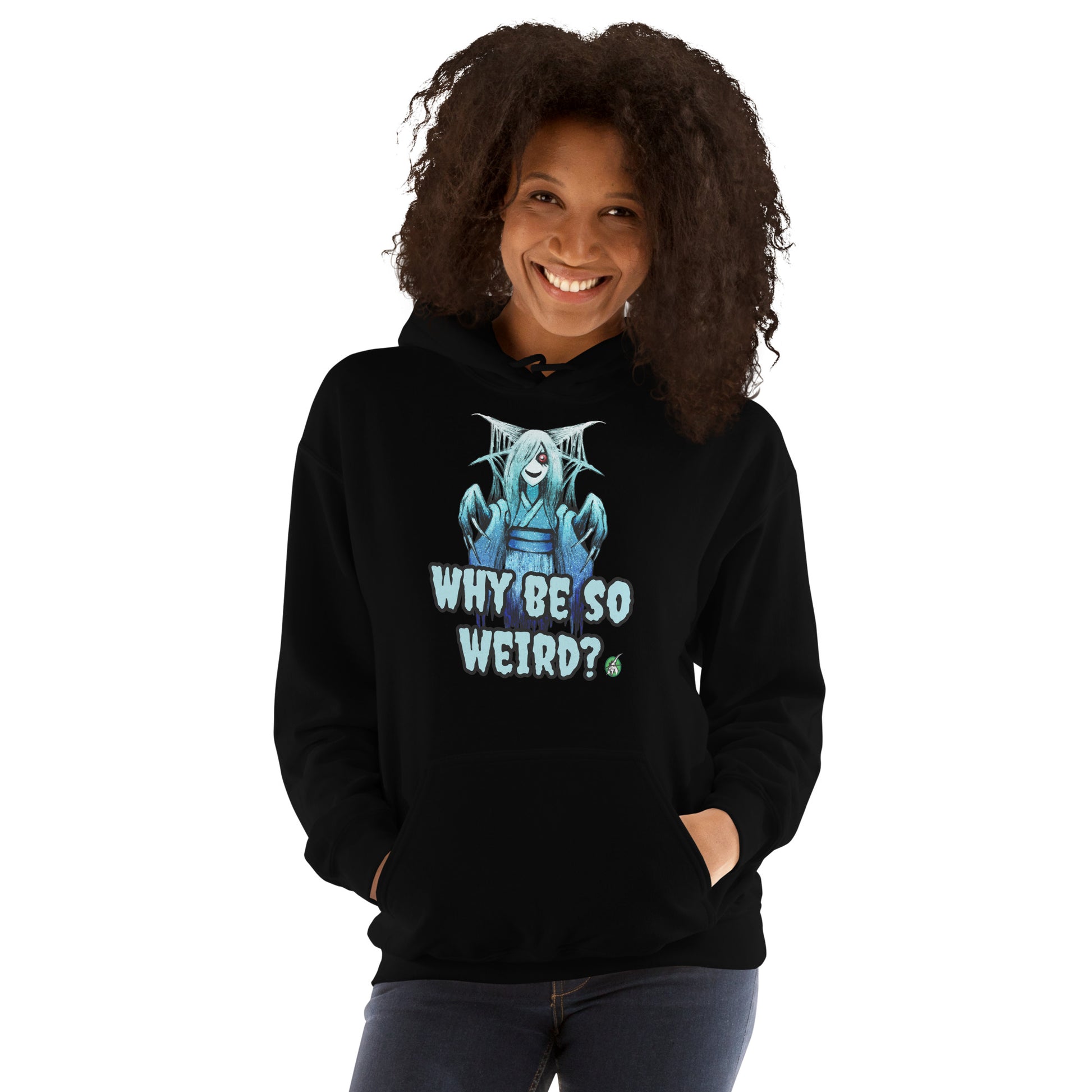 A woman standing and wearing a black hoodie with a printed graphic of a blue ghost girl with the words, 'Why Be So Weird?'. Designed by Wizard Prints.