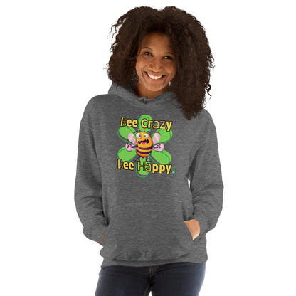 A woman standing wearing a dark grey hoodie with a printed graphic of a bee with the words, 'Bee Crazy Bee Happy'. Designed by Wizard Prints.