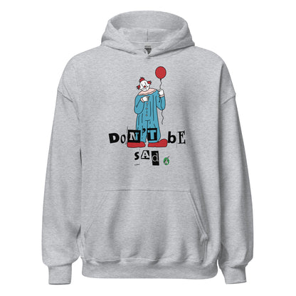 Women's grey hoodie with a printed graphic of a clown holding a balloon with the words, 'Don't Be Sad'. Designed by Wizard Prints.