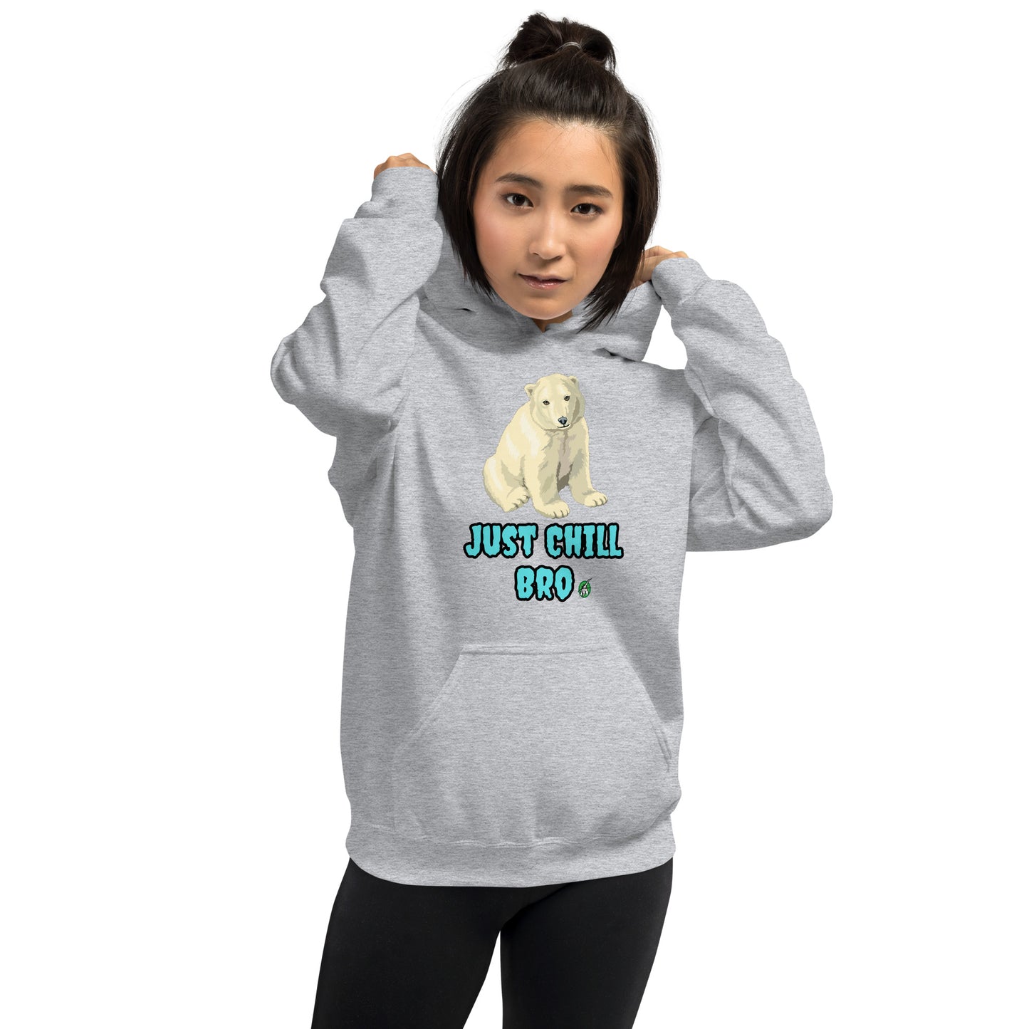 A woman standing wearing a grey hoodie with a printed graphic of a bear with the words, 'Just Chill Bro'. Designed by Wizard Prints.