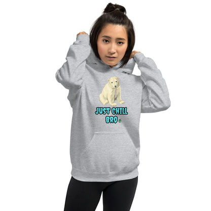 A woman standing wearing a grey hoodie with a printed graphic of a bear with the words, 'Just Chill Bro'. Designed by Wizard Prints.