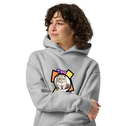 A woman standing wearing a grey hoodie by Wizard Prints featuring a printed graphic of a grumpy cat with the words, Too Peopley.