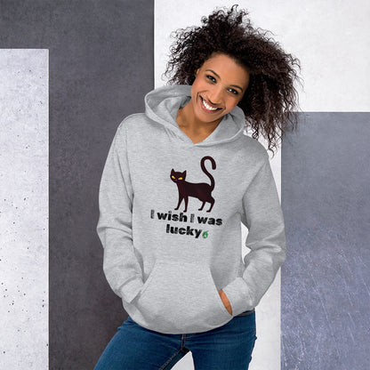A woman standing and wearing a grey hoodie with a printed graphic of a cat with the words, 'I wish I was lucky'. Designed by Wizard Prints.