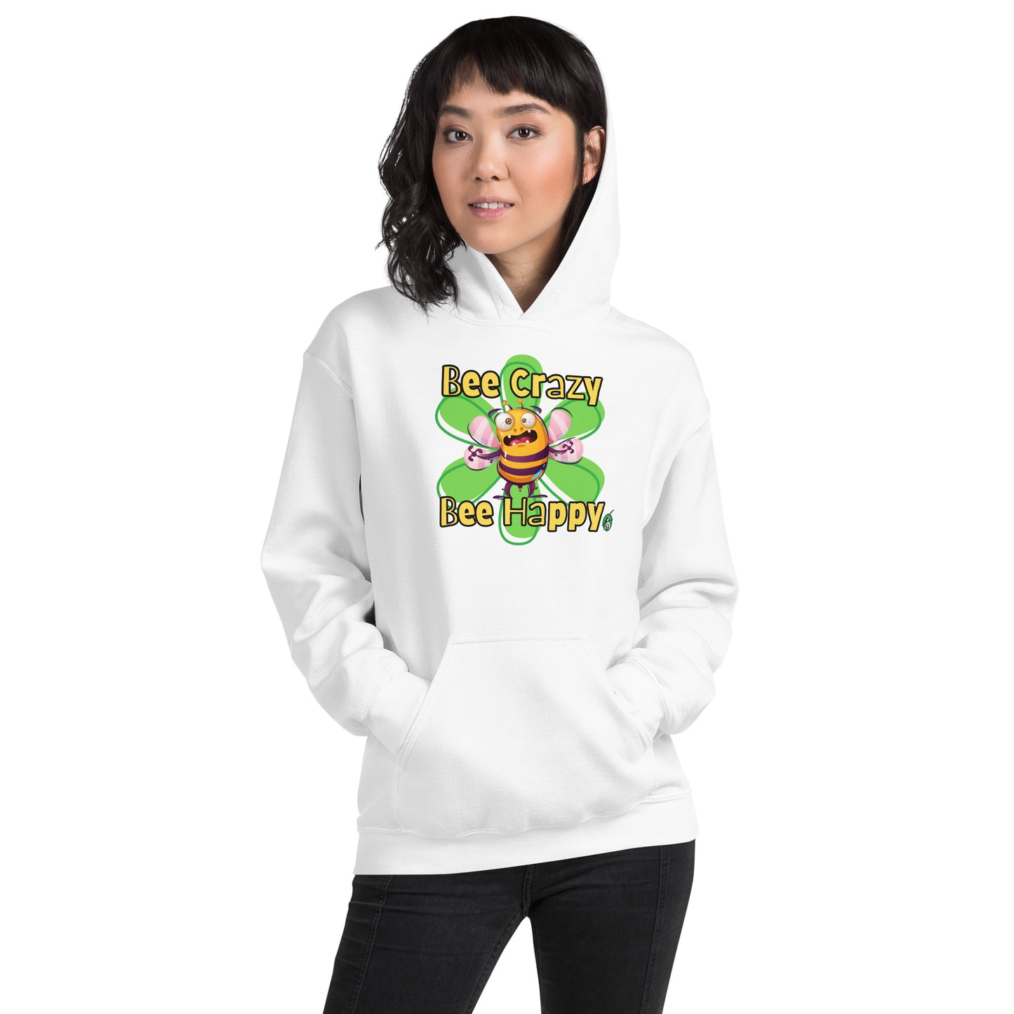 A woman standing wearing a white hoodie with a printed graphic of a bee with the words, 'Bee Crazy Bee Happy'. Designed by Wizard Prints.