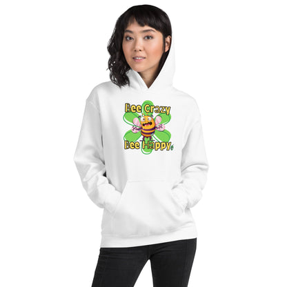 A woman standing wearing a white hoodie with a printed graphic of a bee with the words, 'Bee Crazy Bee Happy'. Designed by Wizard Prints.