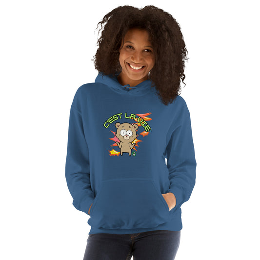 A woman standing wearing an indigo hoodie by Wizard Prints featuring a printed graphic of a shrugging cartoon bear and the words, C'est La Vie.