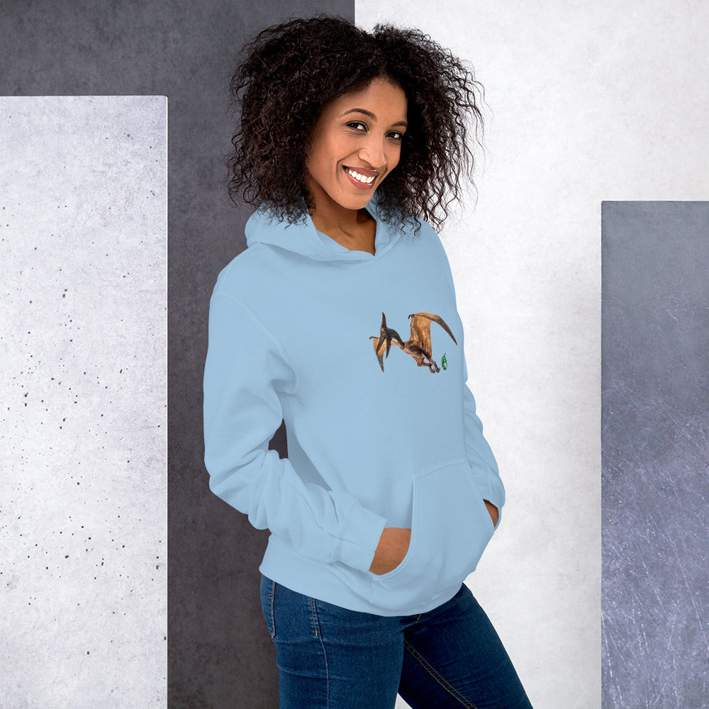 A woman standing wearing a light blue hoodie with a printed graphic of a life like pterodactyl dinosaur. Designed by Wizard Prints.