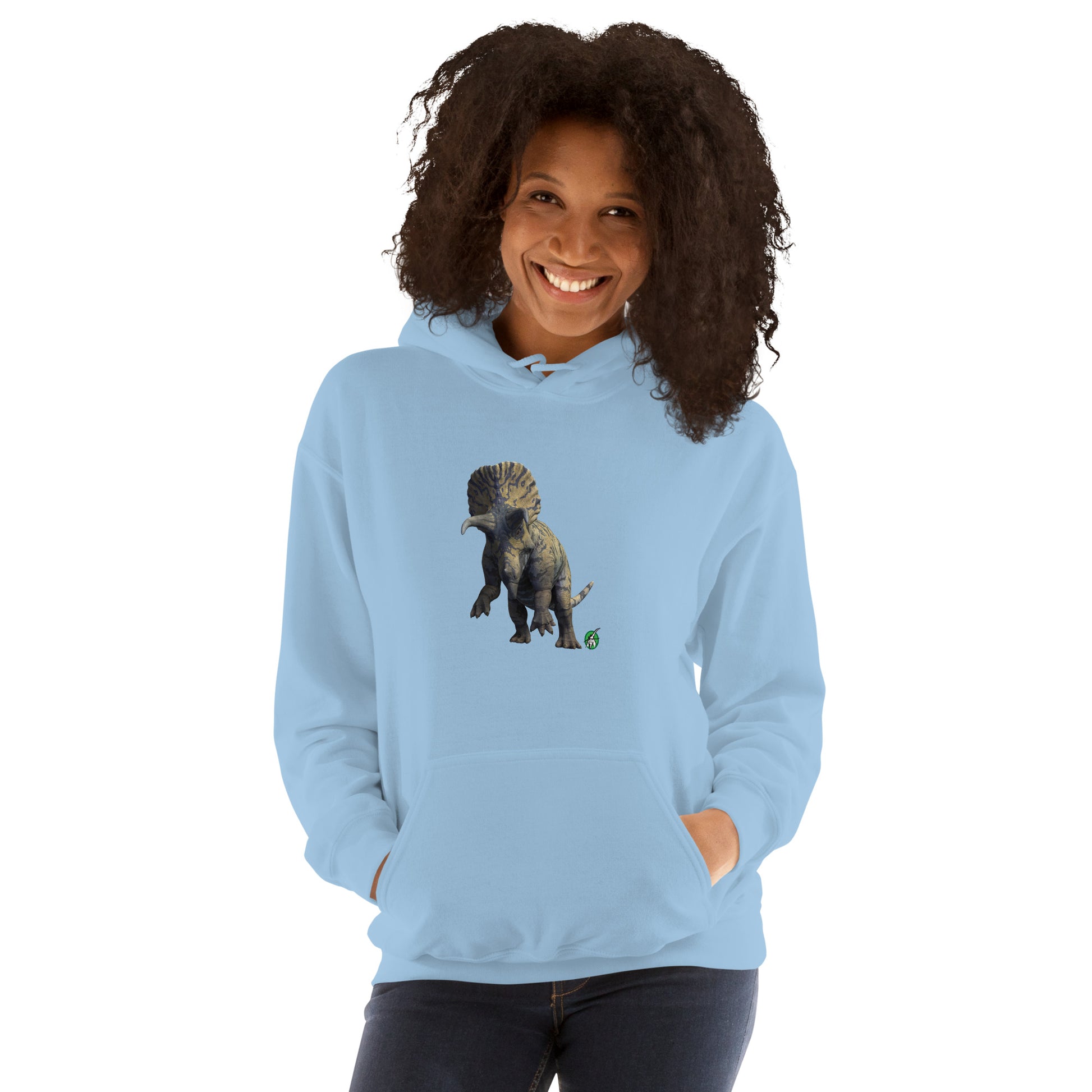 A woman standing wearing a light blue hoodie with a printed graphic of a life like dinosaur. Designed by Wizard Prints.