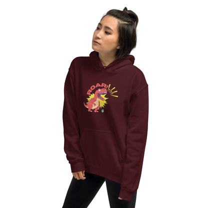 A man standing wearing a maroon hoodie with a printed graphic of a red roaring cartoon dinosaur and the word Roar! Designed by Wizard Prints