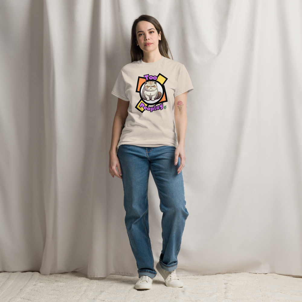 A woman standing wearing a beige T-Shirt with a grumpy cat with the words, 'Too Peopley'. Designed by Wizard Prints