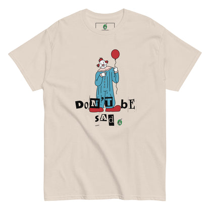 Women's beige T-Shirt with a printed graphic of a clown holding a balloon with the words, "Don't be sad". Designed by Wizard Prints.