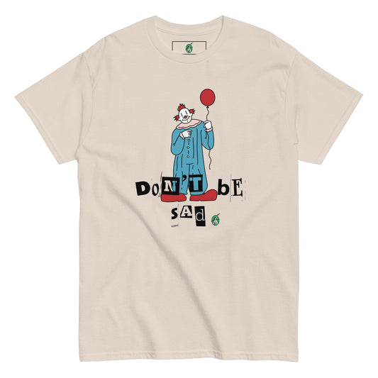 Women's beige T-Shirt with a printed graphic of a clown holding a balloon with the words, "Don't be sad". Designed by Wizard Prints.