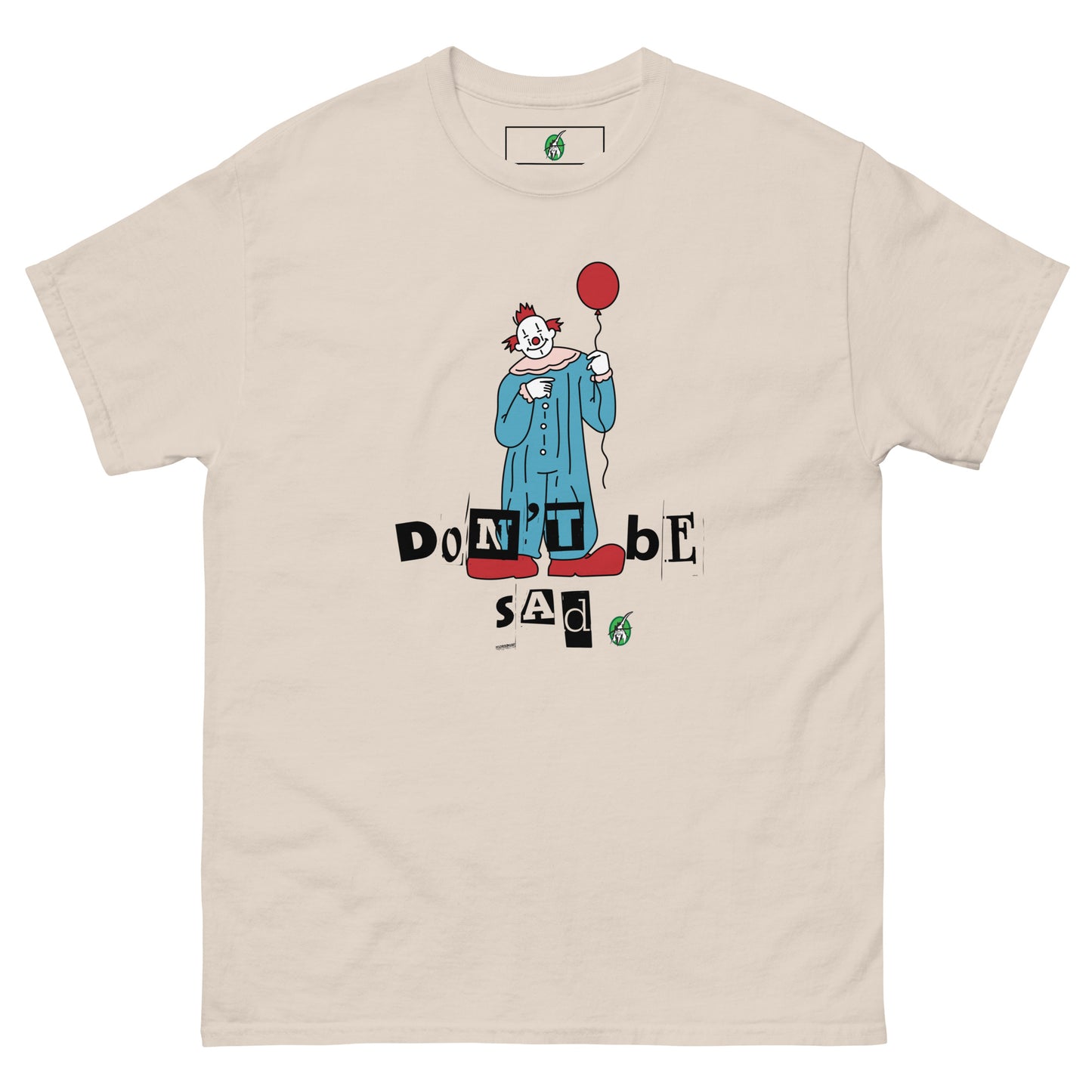Women's beige T-Shirt with a printed graphic of a clown holding a balloon with the words, "Don't be sad". Designed by Wizard Prints