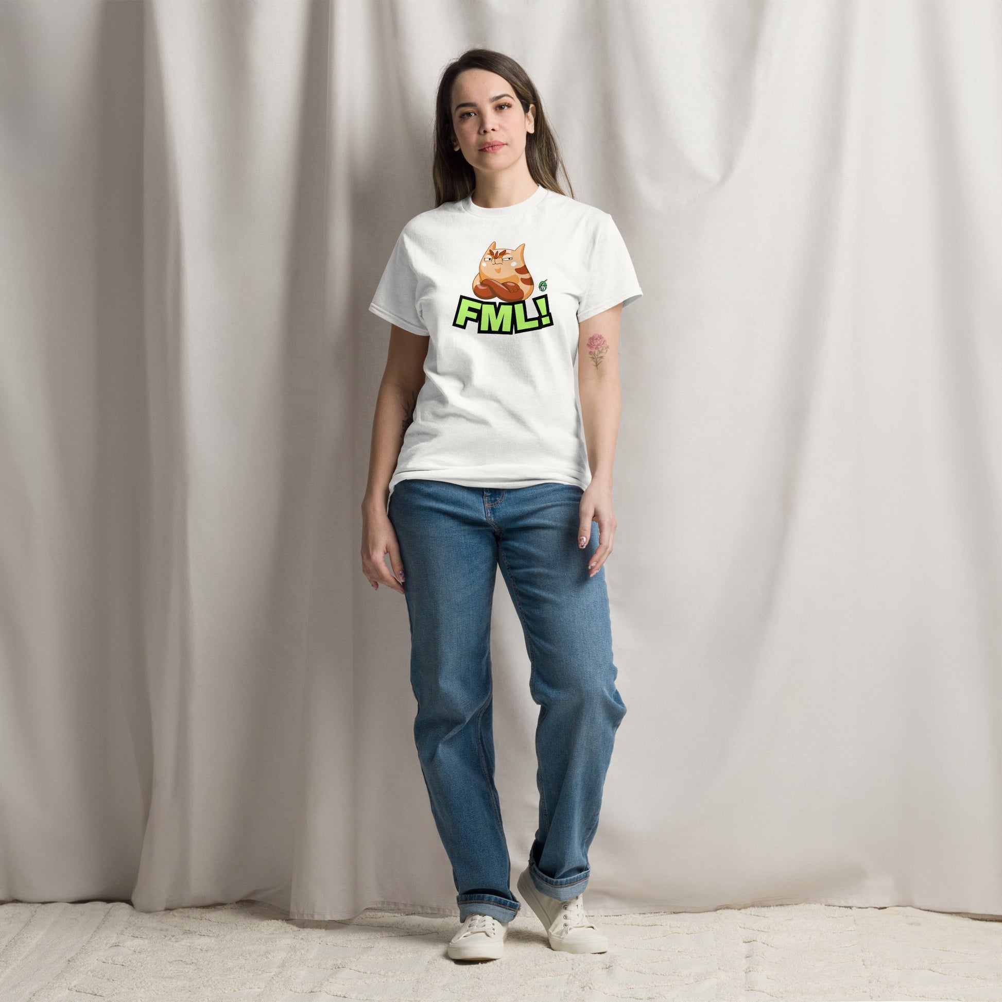 A woman standing and wearing a white t-shirt with a printed graphic of a cat with the words, 'FML!'. Designed by Wizard Prints.